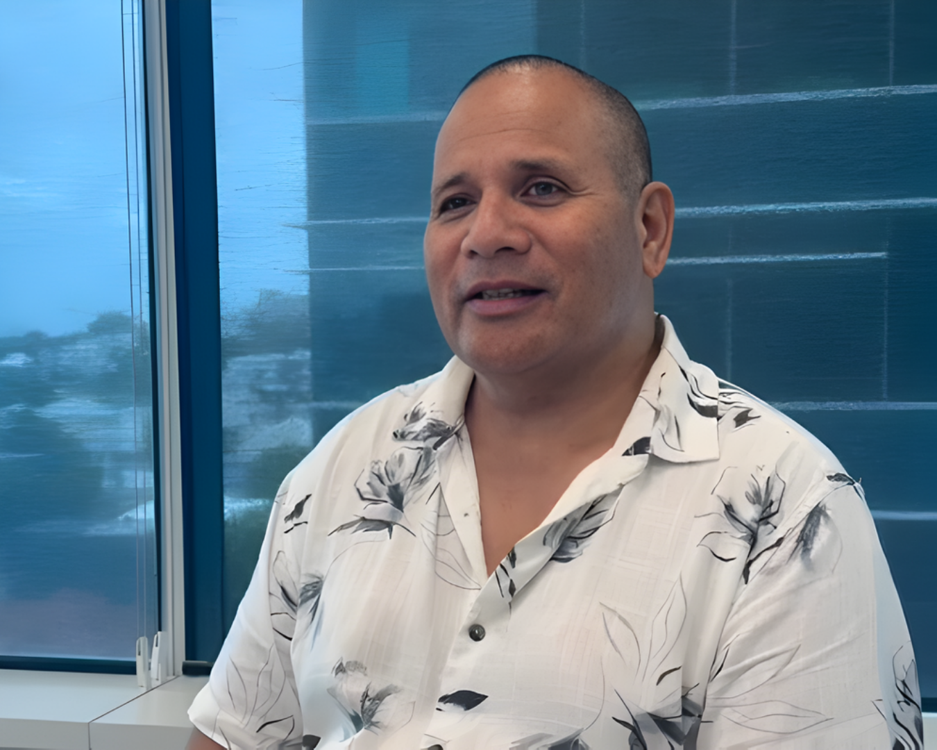 Four people stand in front of a client truck, including two workers in high-vis uniforms, a client and a recruitment manager, representing skilled trades recruitment.