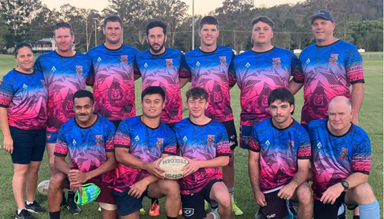 A team of players standing and crouching to take a picture 