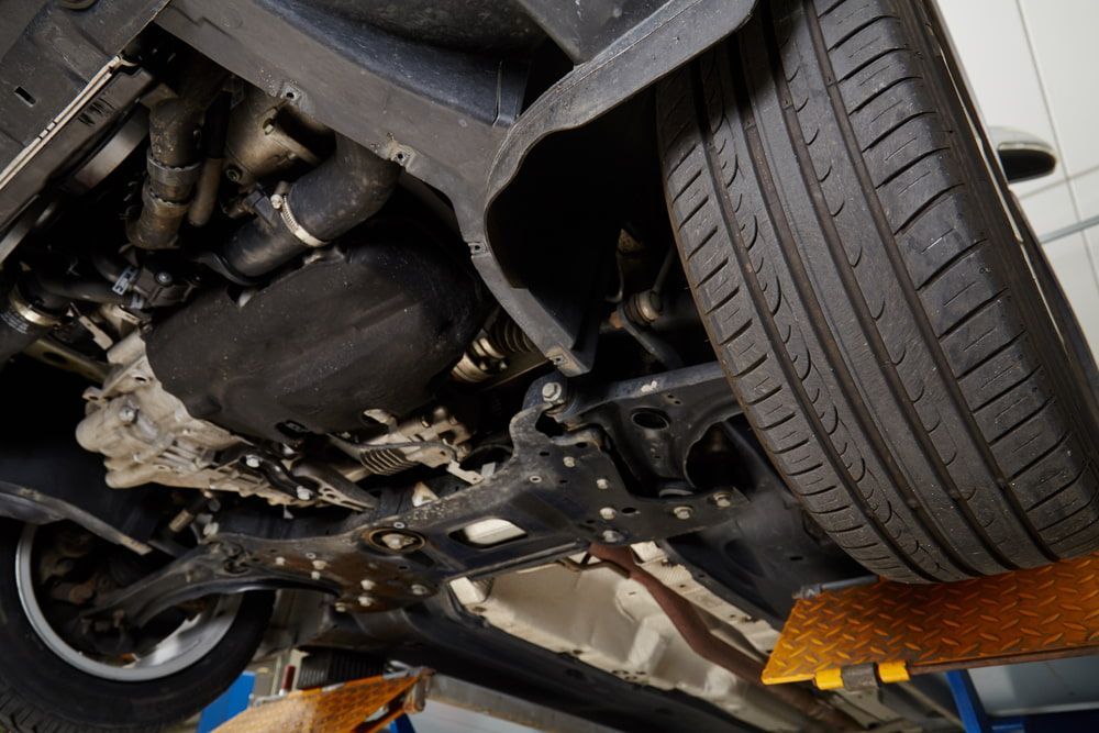 A Close Up of the Underside of a Car on a Lift — Bob Best Mechanical in Drayton, QLD