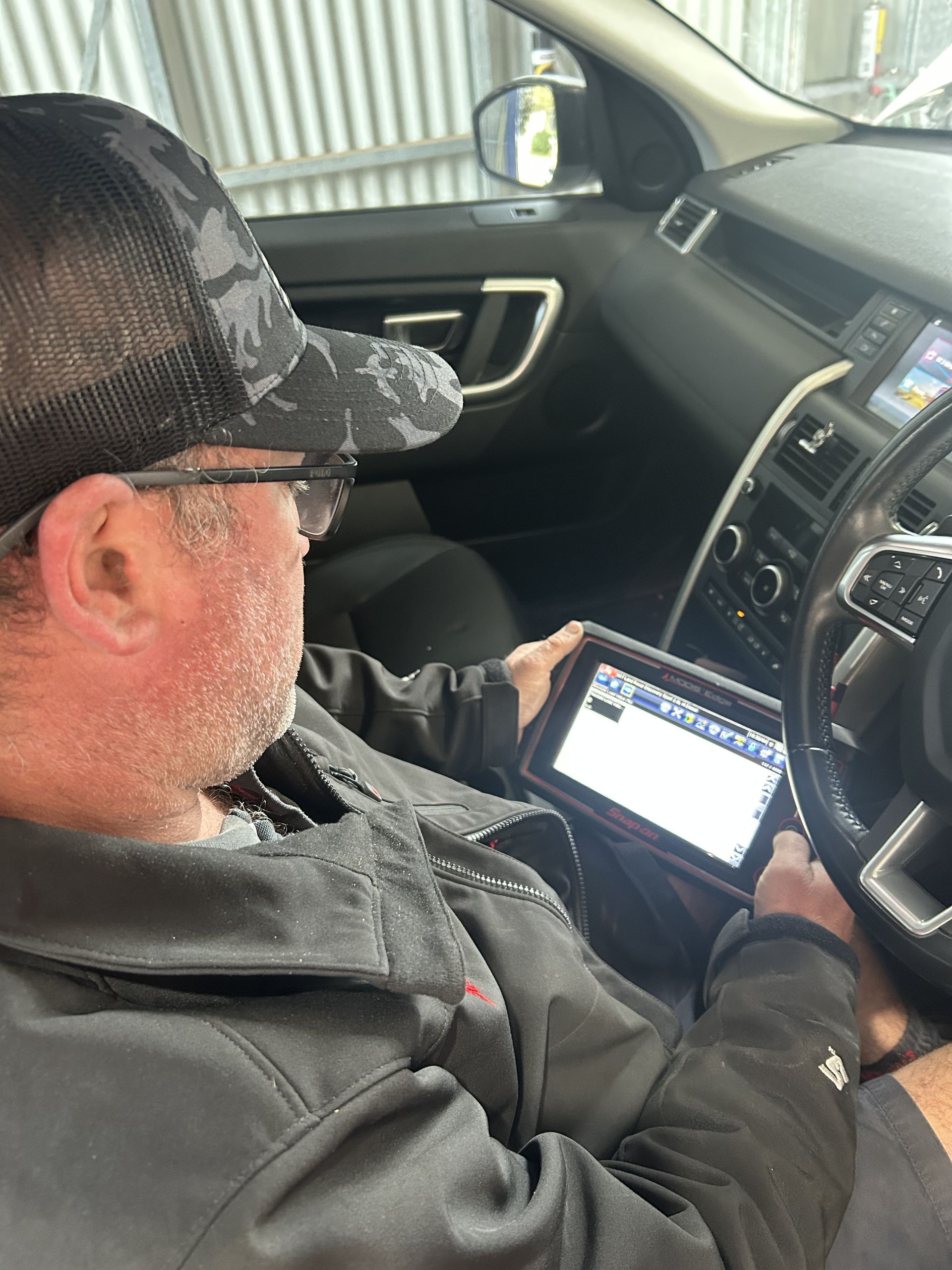 Mechanic Sitting in Car  — Bob Best Mechanical in Drayton, QLD