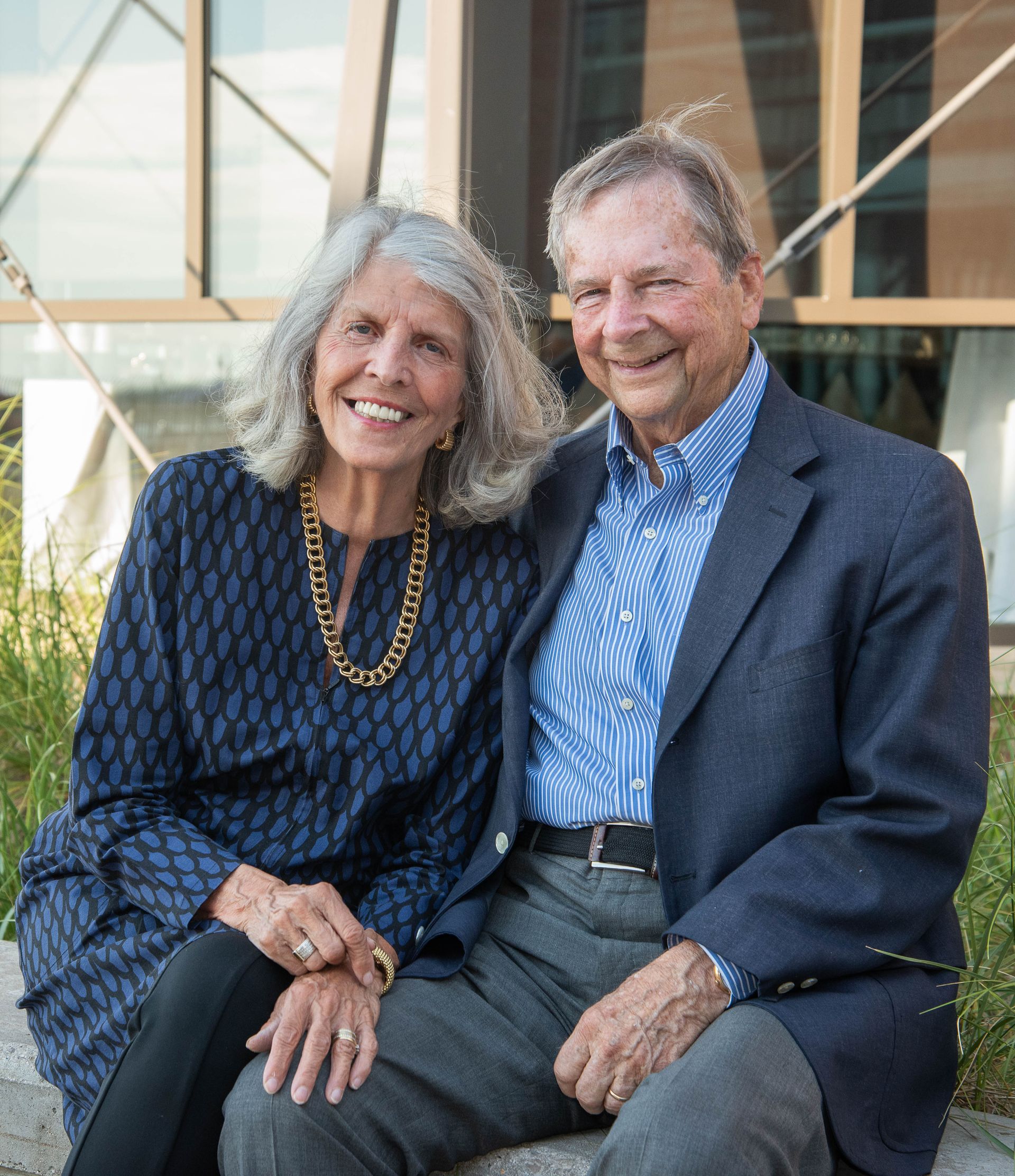 Man with graying beard and hair, looking left, indoors.