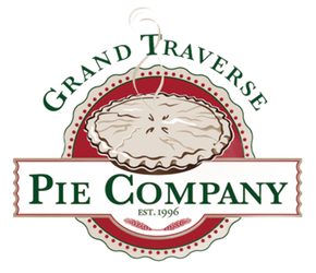 A logo for mercantile bank with a gold triangle on a white background