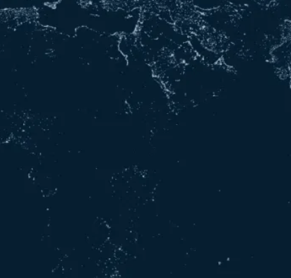 A close up of a splash of water on a dark blue background.