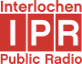A red and white logo for interlochen public radio