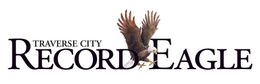 A logo for traverse city record eagle with an eagle on it