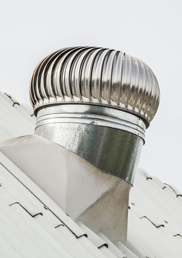 A Stainless Steel Roof Vent on Top of a White Roof — SRV Roofing in Gympie, QLD