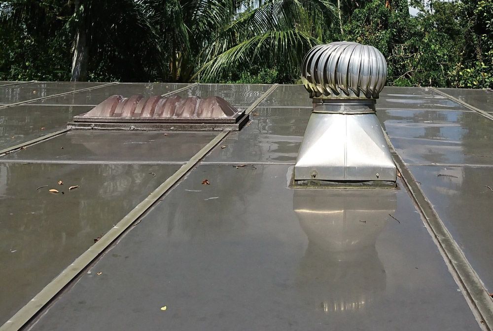 A Roof With a Stainless Steel Fan on Top of It — SRV Roofing In Kingaroy, QLD