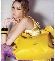 girl sitting with handbag