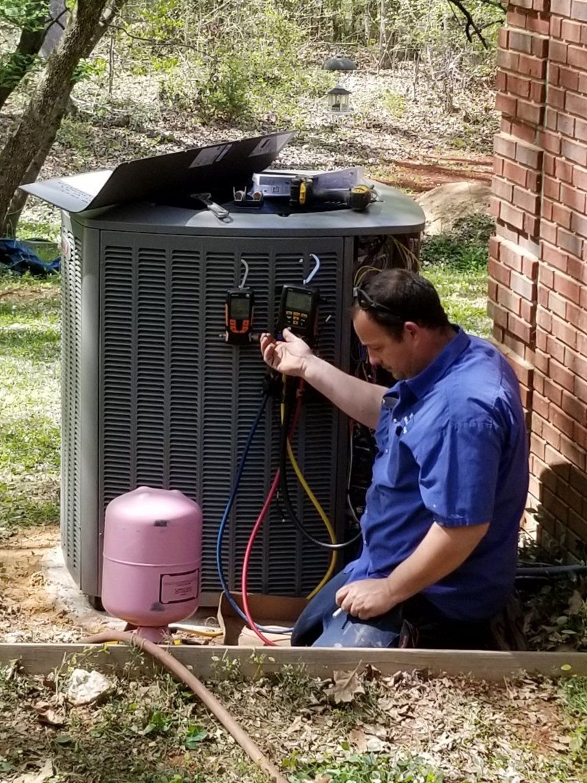 Person performing an AC installation in Lexington, SC