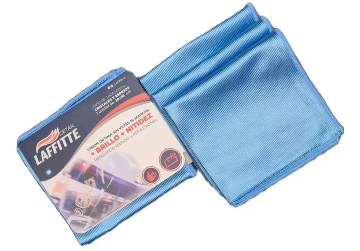 Dos paños de microfibra azules enrollados con paño de limpieza e instrucciones del producto, configuración interior.