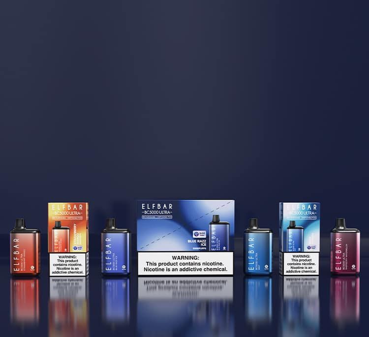 Various Elf Bar disposable vapes on a dark blue surface, different colors, with warning label.