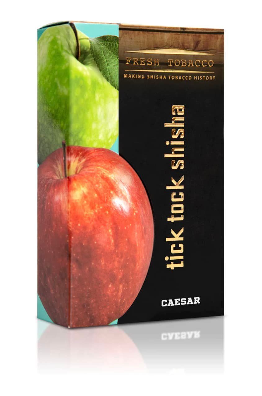 Box of Caesar Tick Tock Shisha, featuring a green and red apple, and gold text on a black background.