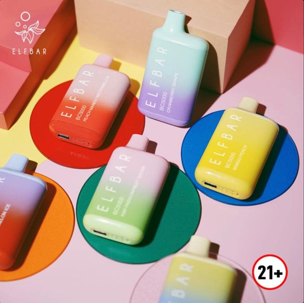 Colorful Elf Bar vape devices on colored circles, set against a pink background; 21+ warning.