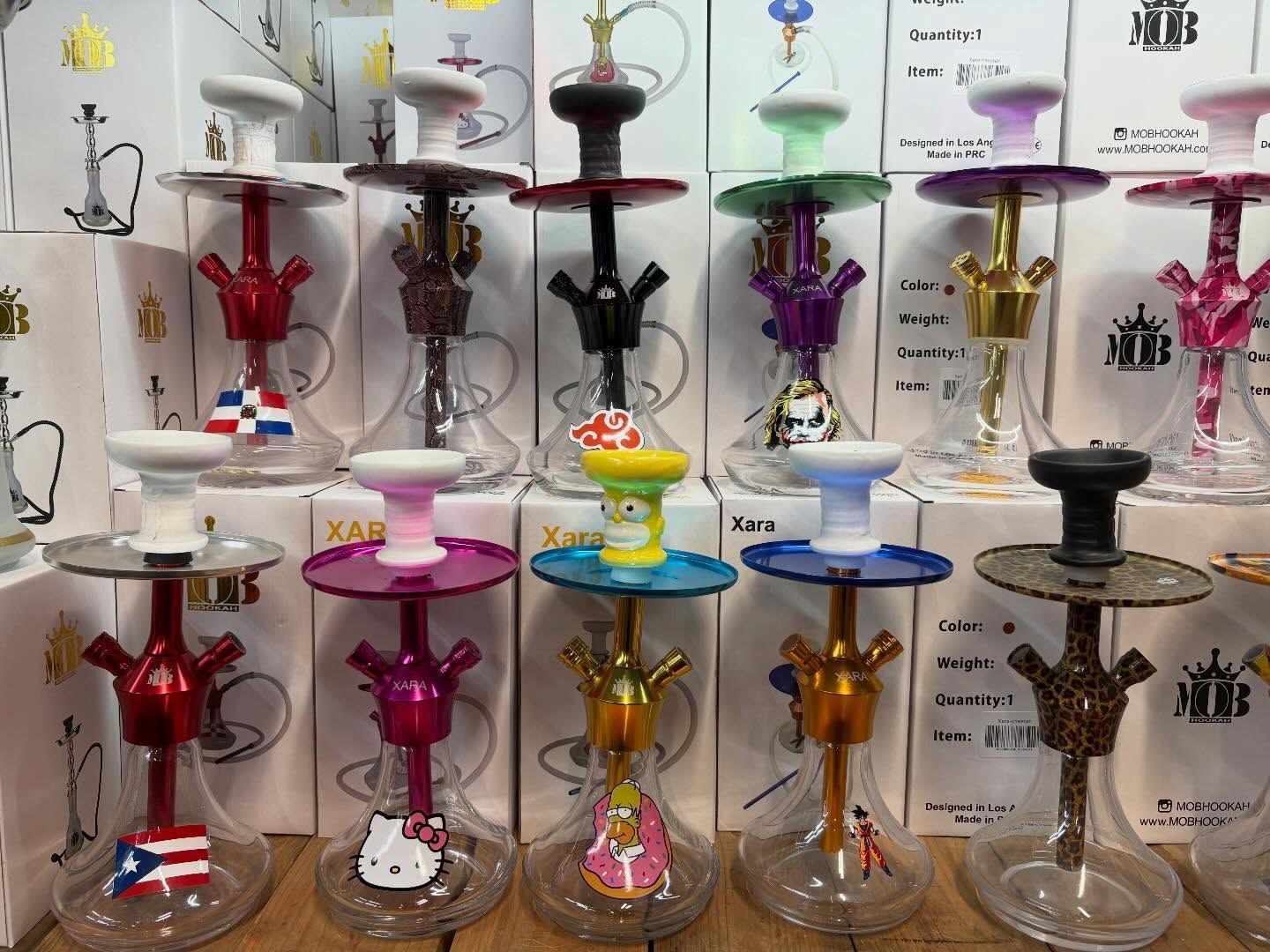 Rows of colorful hookahs on display, various colors and designs.