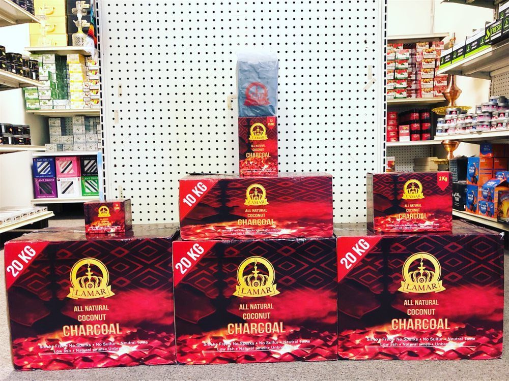 Charcoal display in a store, featuring multiple boxes of 