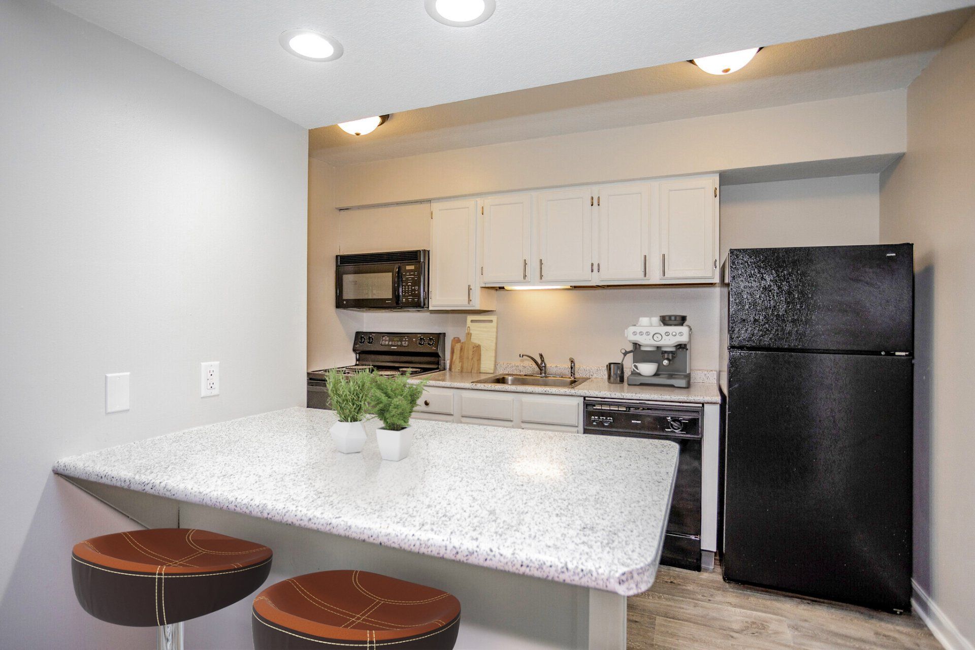 Two BR Apartments in Urbandale IA - The Vibe at 8035 - Modern Kitchen with Granite-Style Countertops