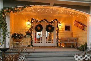 white house with lights - Landscaping Services