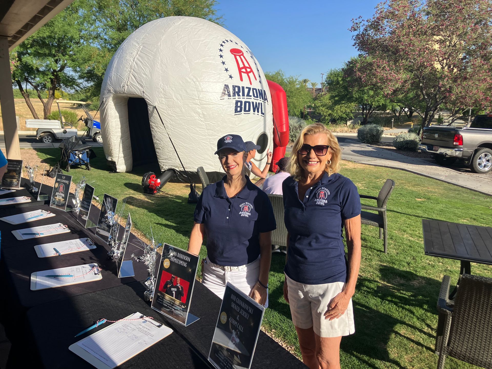 Arizona Blue Blazers, giant helmet and volunteers at golf fundraiser.