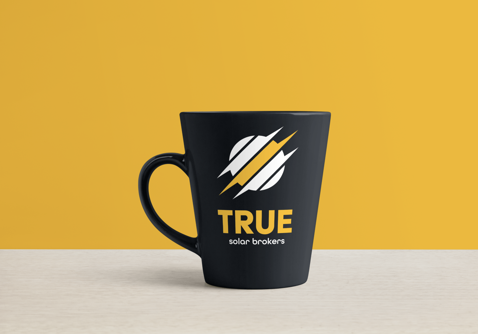 a black coffee mug with the word true on it