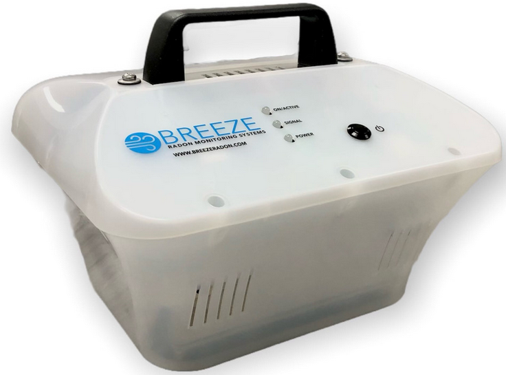 A person is holding a blue box on top of a tripod.