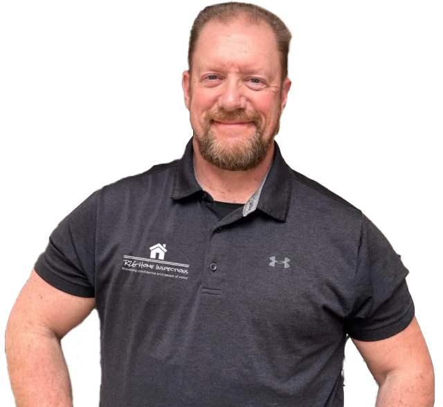 A man with a beard wearing a black under armour shirt