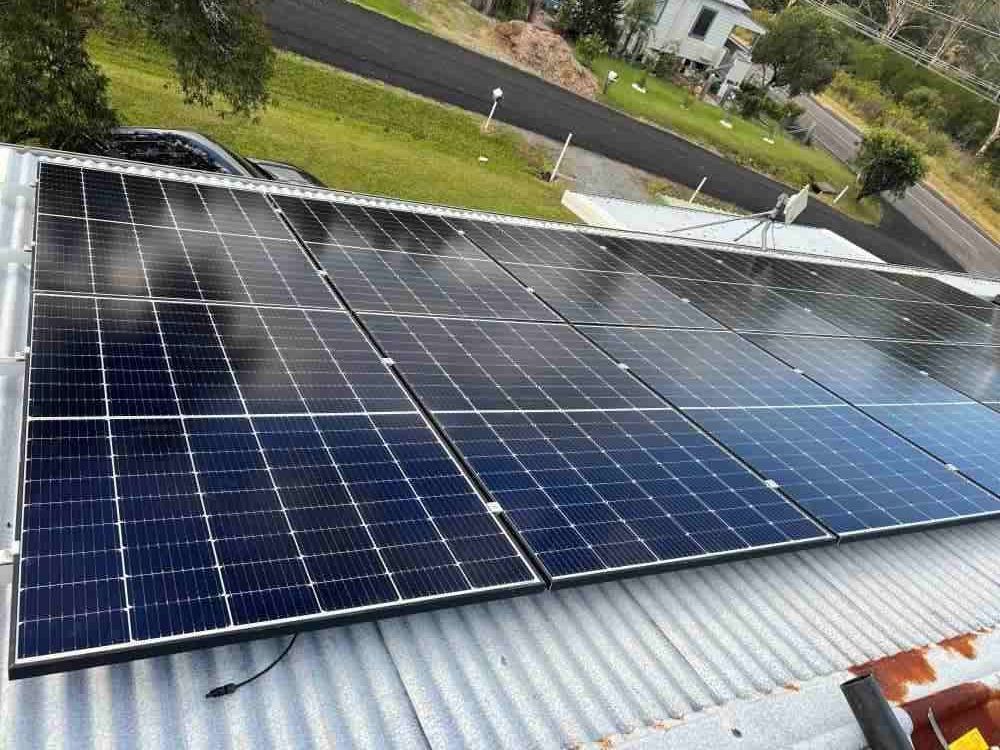 A Row of Solar Panels on the Side of a Building — JW Electrical, Air & Solar Pty Ltd in Kew, NSW