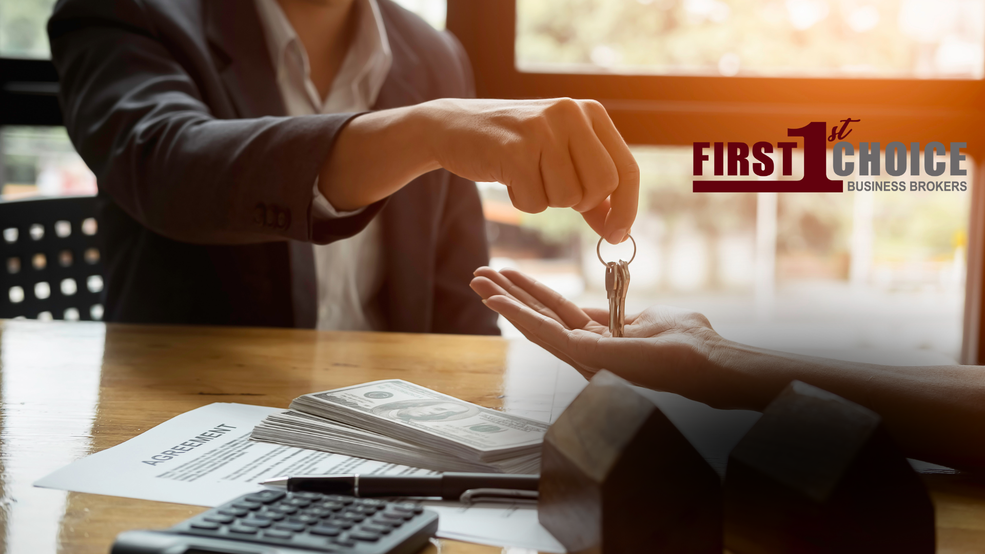 A man is giving a woman the keys to a house.