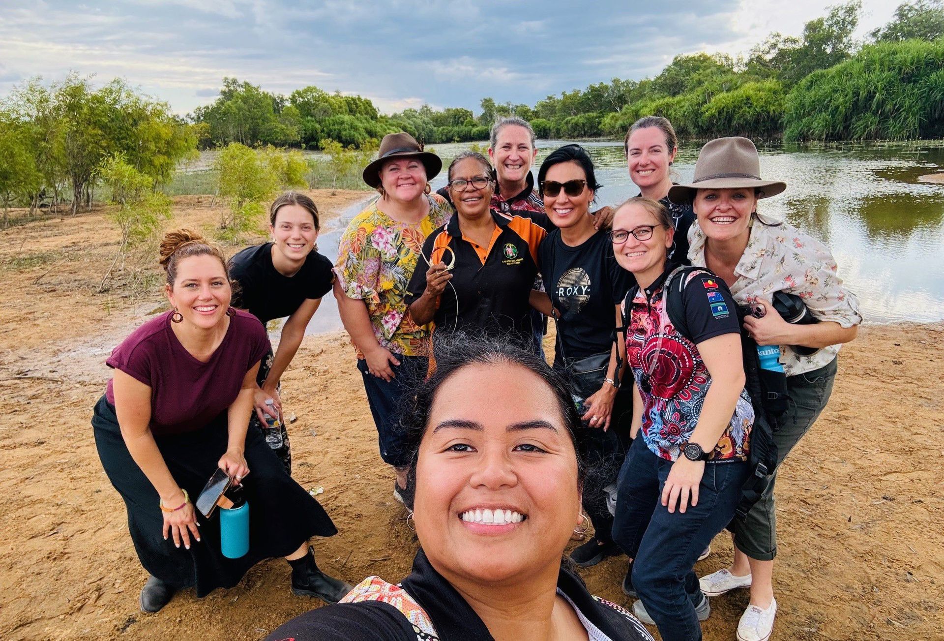 Tourists Taking a Group Photo in Front of a Billabong— Kakadu Billabong Safari Camp in Kakadu, NT