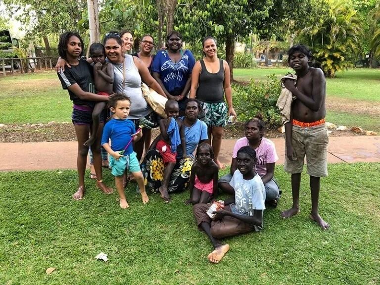 Group of People Posing Outdoors on Grass — Kakadu Billabong Safari Camp in Kakadu, NT