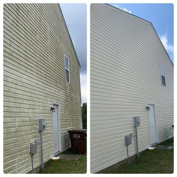 A before and after picture of a house's siding being cleaned.