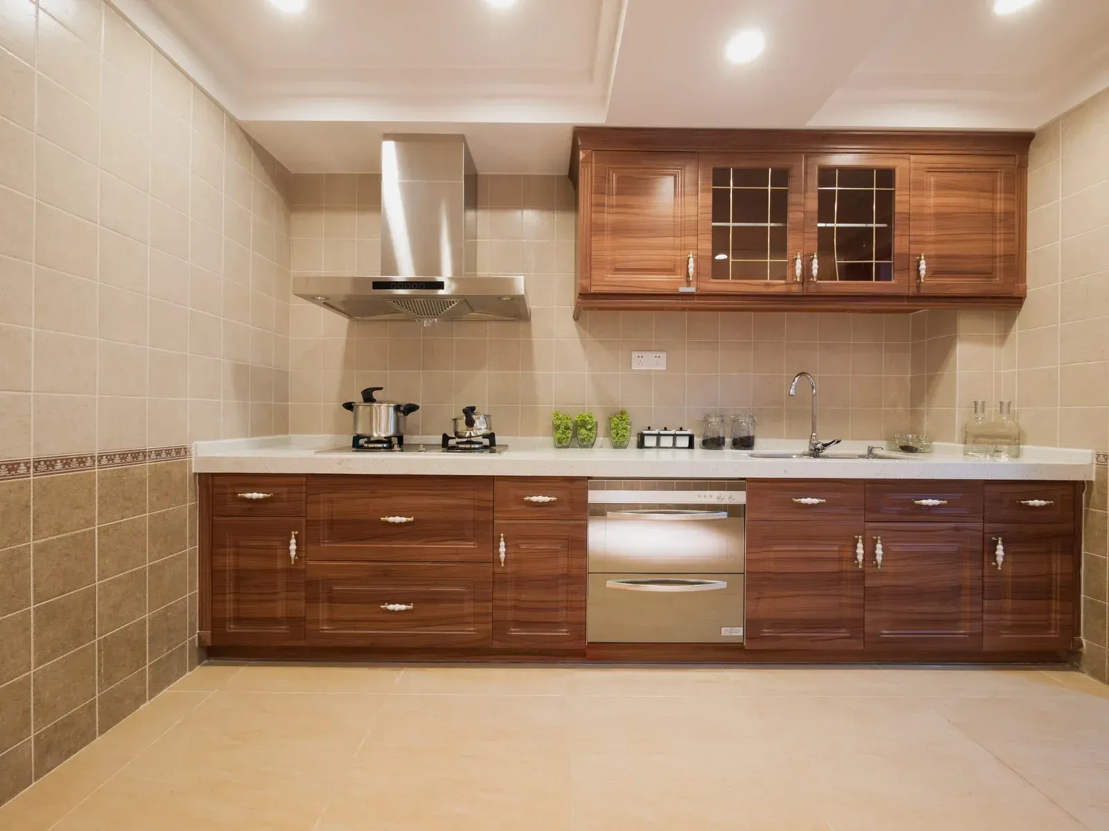 A kitchen with wooden cabinets and stainless steel appliances.