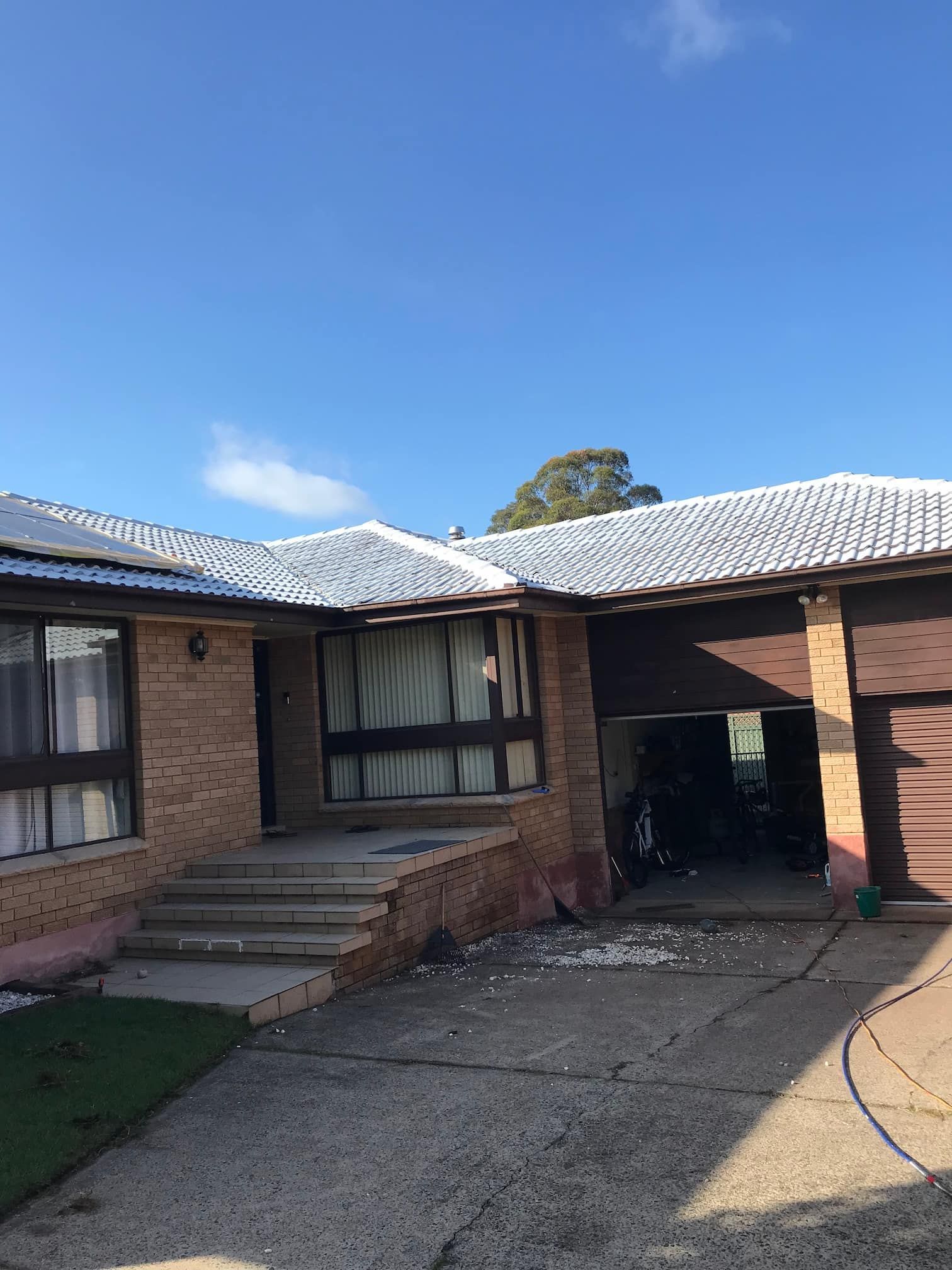 A before image of a roof being painted in Campbelltown