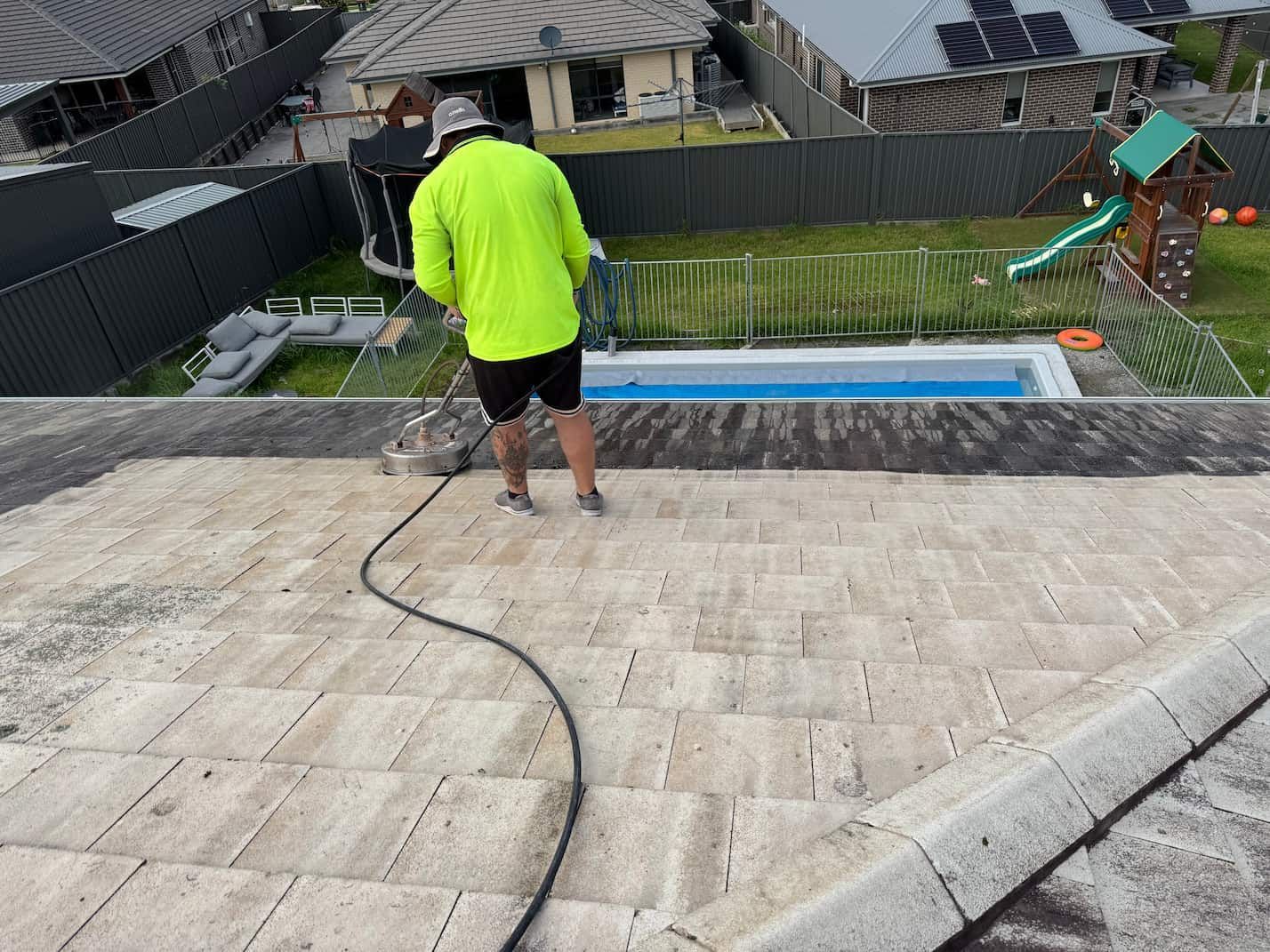 A person cleaning a roof in Penrith