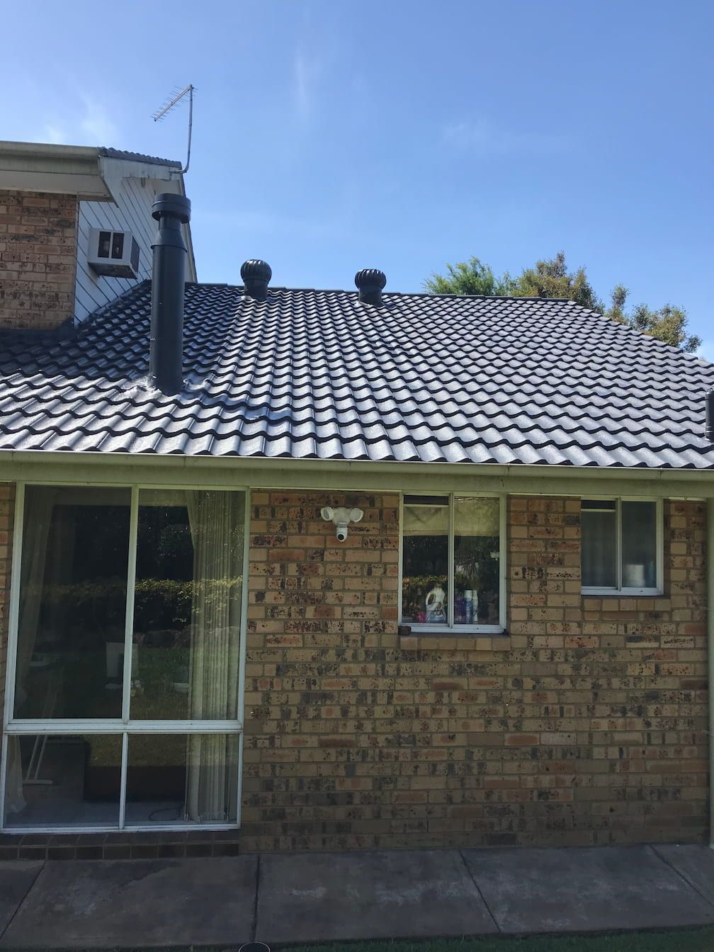 Two whirlybirds on a roof in Campbelltown