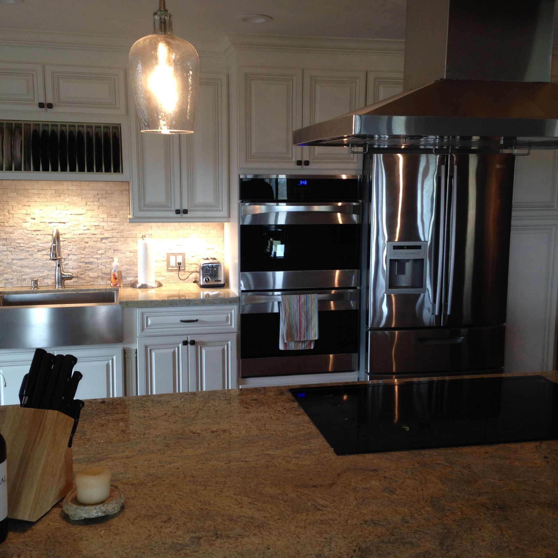 Kitchen with white cabinets, stainless steel appliances, and a granite countertop.