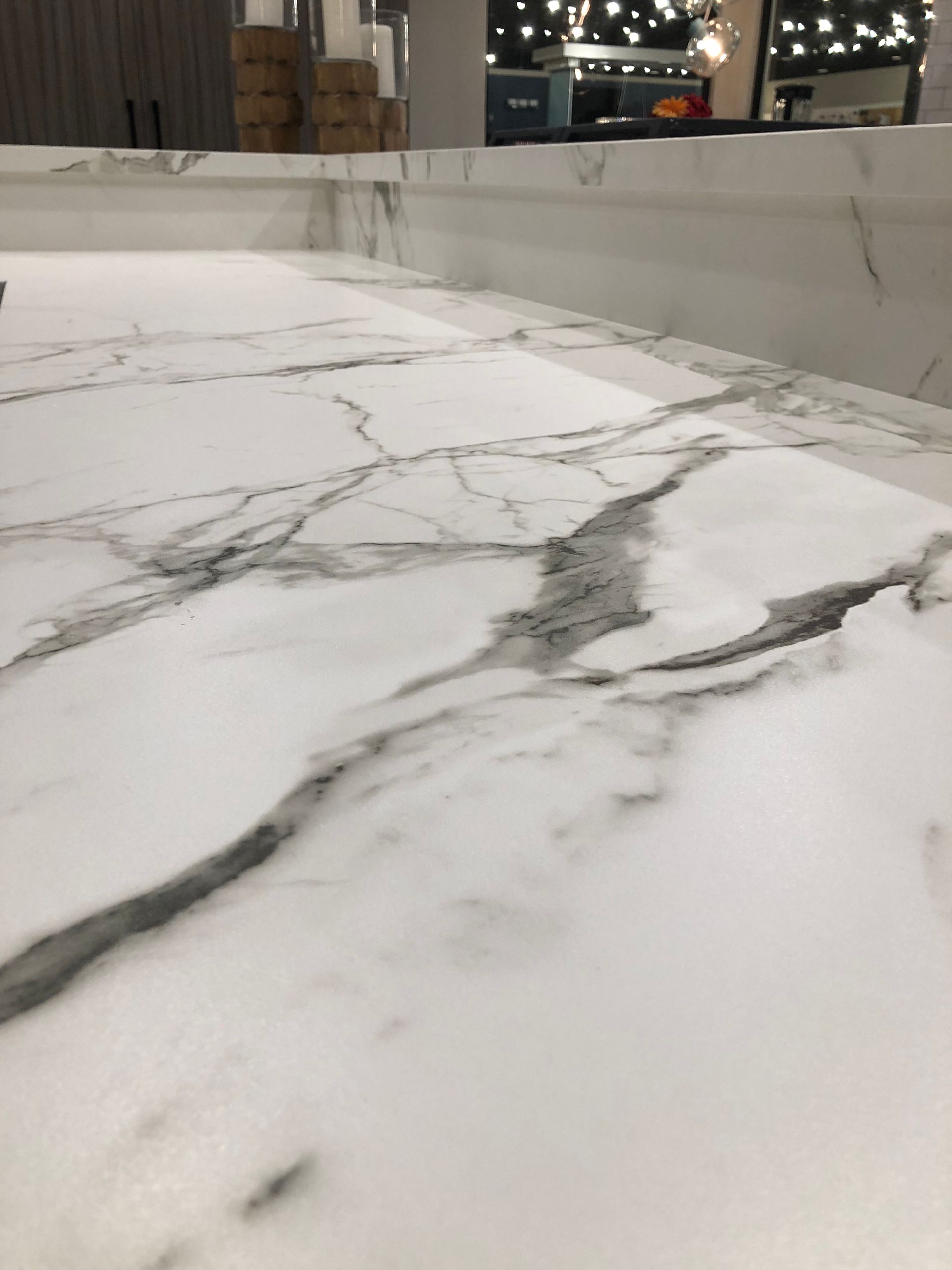 White marble countertop with gray veining.