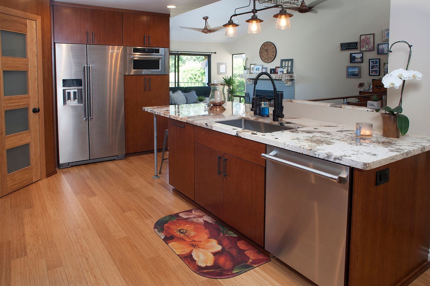 Kitchen with wood cabinets, stainless steel appliances, and granite countertops.