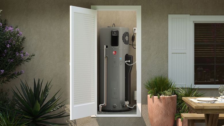 A person is working on a water heater in a room.
