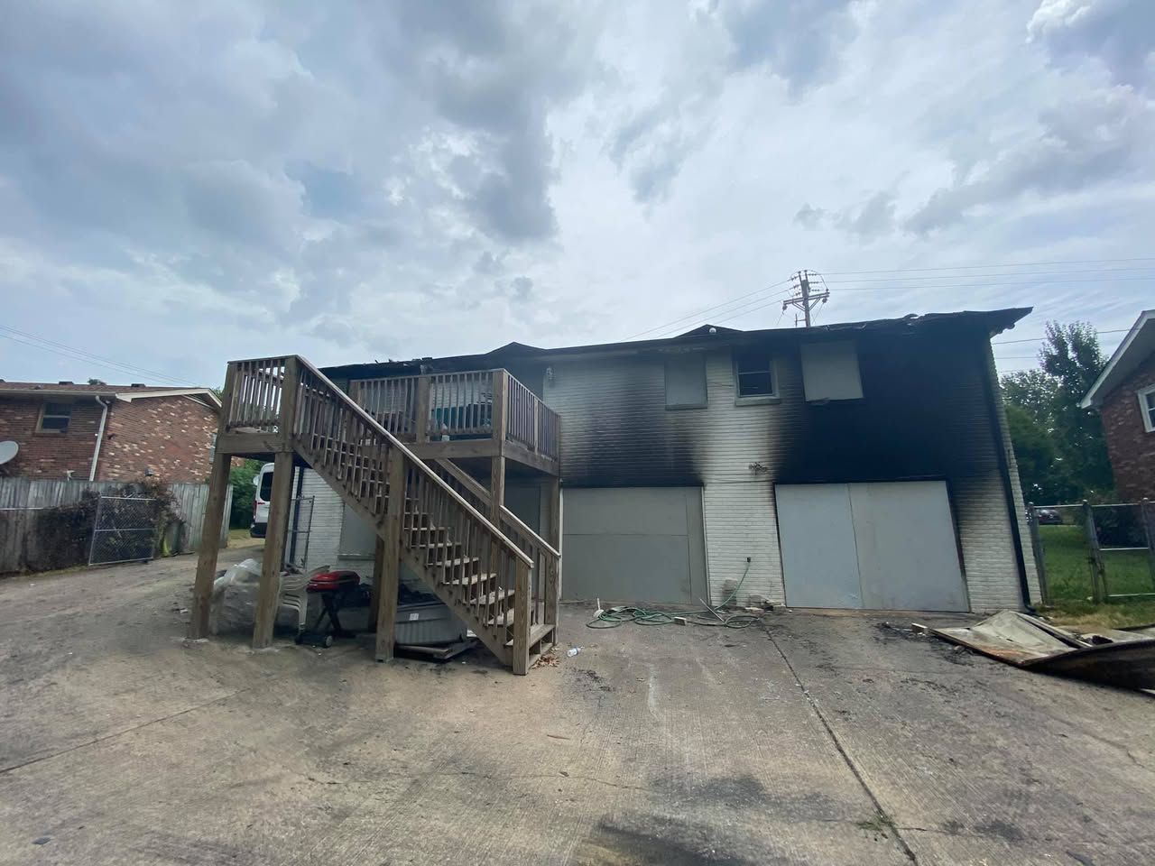 A house with stairs leading up to it has been damaged by a fire.