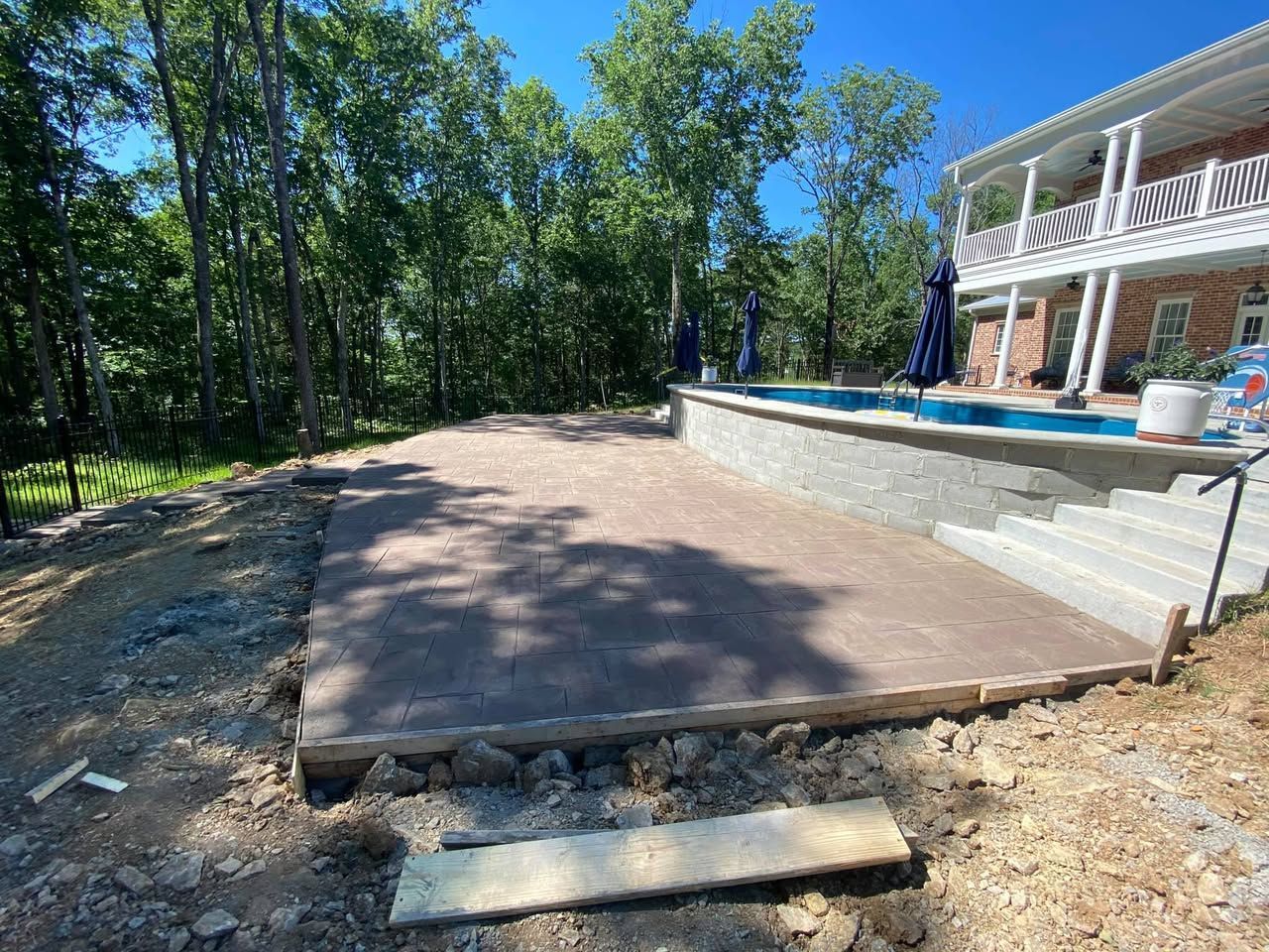 A large house with a swimming pool in the backyard.