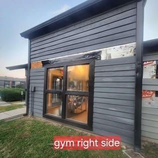 A picture of a gym on the right side of a building.