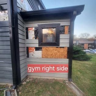 A building with a sign that says gym right side
