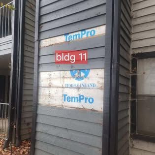 A building with a sign on it that says tempro bldg 11