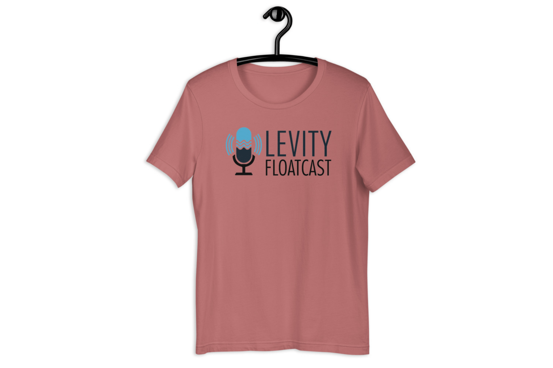 A t-shirt with a microphone on it is hanging on a hanger.