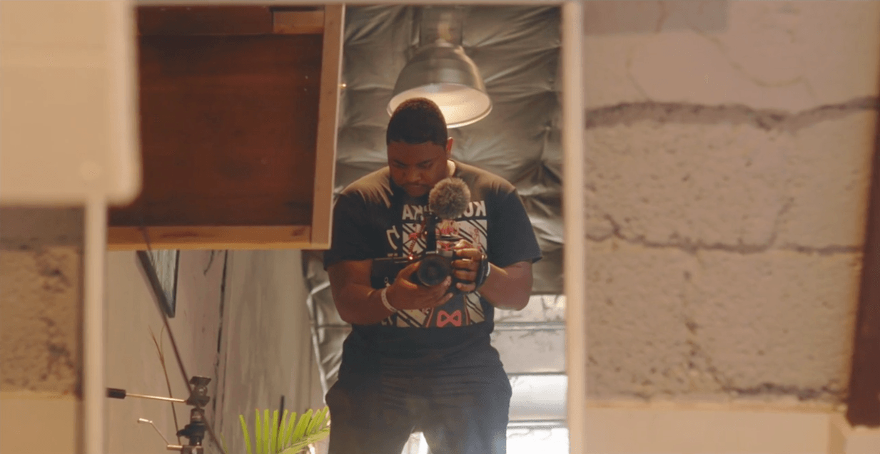 A man is taking a picture of himself in a mirror.