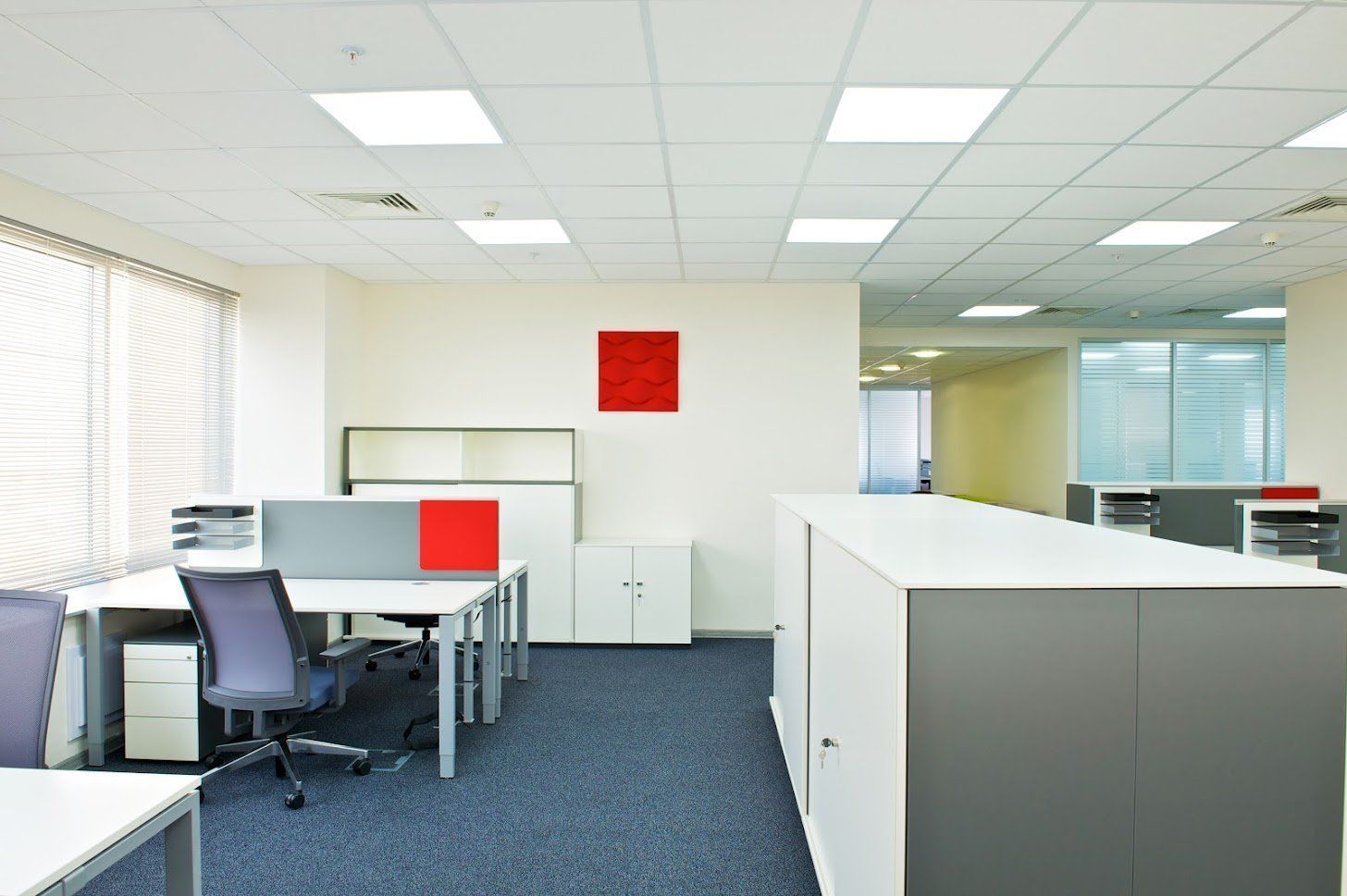 An office with a red square on the wall