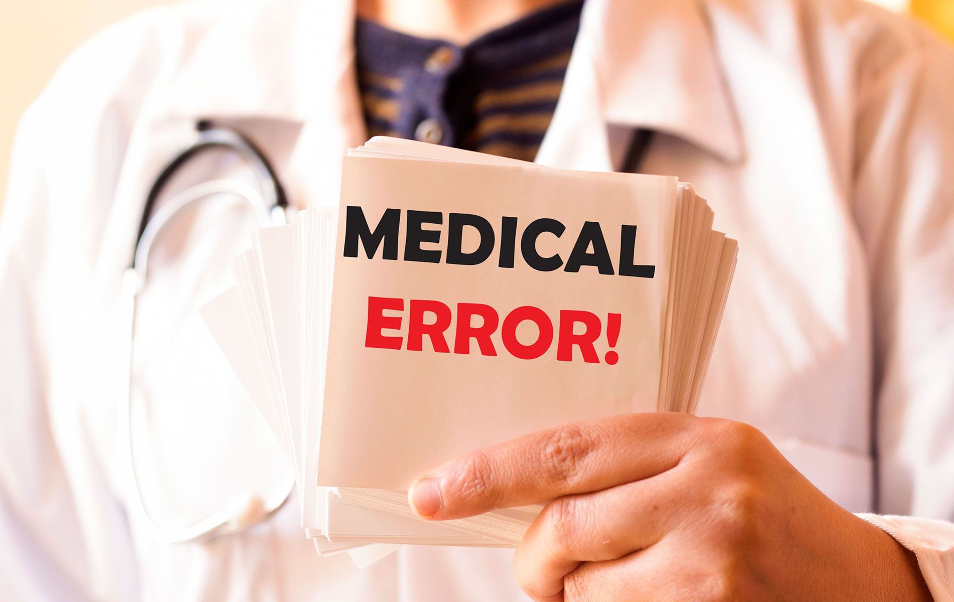 Doctor holding a paper with medical error note on it