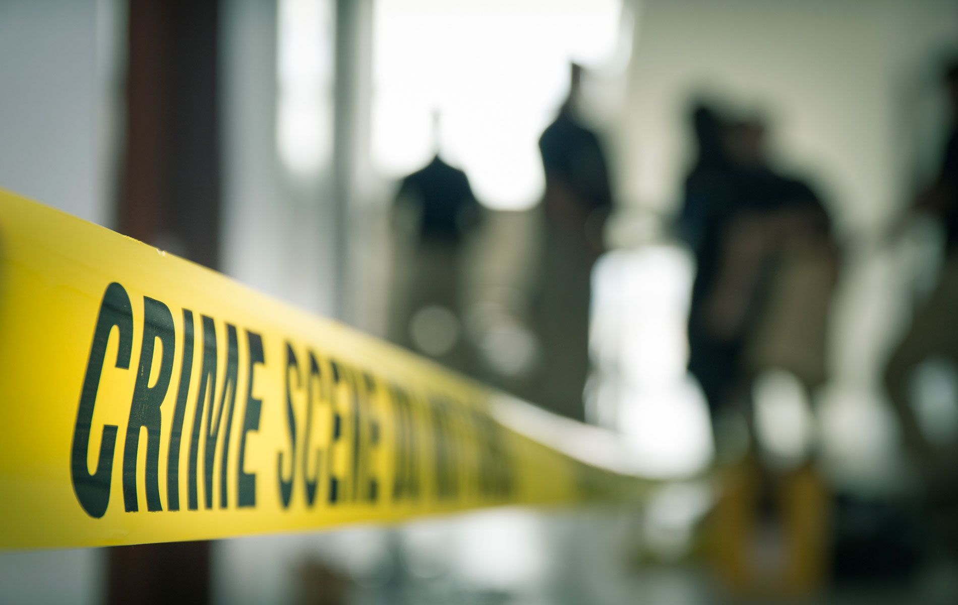 A yellow tag of crime scene on the background