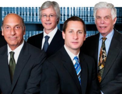 A group of men in suits and ties are posing for a picture