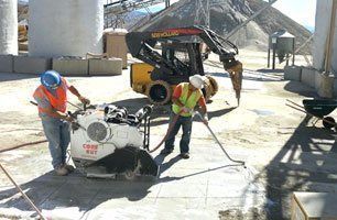 Workers Cutting the Cement Floor — Desert Hot Springs, CA — Spartan Concrete